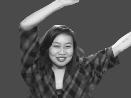 Video gif. A woman jumps side to side with her arms in the air in celebration. The text says, “Do it! Do it!”