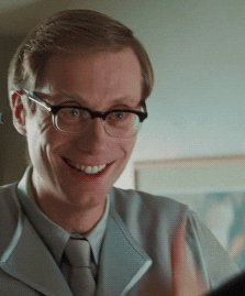 The Office UK gif. Stephen Merchant as Oggy. He gives us a thumbs up accompanied by a wide goofy smile, with his eyebrows raised deep into his forehead and eyes shining. 