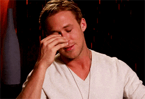 Celebrity gif. Ryan Gosling looks stressed as he leans to the side and rubs his forehead. 