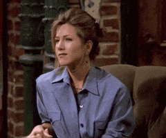 Friends gif. Jennifer Aniston as Rachel raises her eyebrows and rolls her eyes, looking away and putting her hand to her chin.