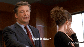 TV gif. Alec Baldwin as Jack gestures to someone off screen as Tina Fey as Liz turns to face them with a look of disgust on her face. Jack says, "Shut it down." 