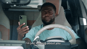 TV gif. Kevin Hart on Real Husbands of Hollywood sits in a van while holding his phone up to talk to it. He says, “I’m just thinking about you. You’re just on my mind as usual.”