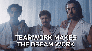 Sponsored gif. Michael Cera stands in between two beefy men who hold a bottle of CeraVe lotion. He hands his arms up on their shoulders and they all smize at us, giving us an intense look as the camera gets closer. They stand in a room filled with light blue, draping fabric. Text, "Teamwork makes the dream work." 