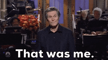 SNL gif. Willem Dafoe standing for his opening monologue, mouth flat eyes blank, nods, confirming "That was me."