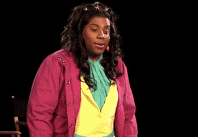 SNL gif. Kenan Thompson dressed as a female Disney channel star holds his hand out to signal to stop and then leans back. He looks at us with big exaggerated eyes.