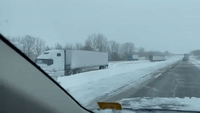 Semi-Trucks Litter Interstate Median as Winter Storm Wreaks Havoc on Illinois