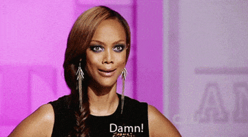TV gif. Tyra Banks looks pleasantly surprised as she says, "Damn!" on a quick loop.
