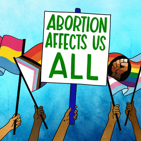 Digital art gif. Hands of different races wave a variety of flags in the air: the trans pride flag, the L-G-B-T-Q pride flag, and others. Another hand waves a large picket sign with all-caps green text that says, "Abortion affects us all," all against an ombre blue background.