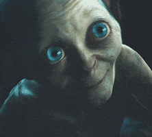 Movie gif. Smeagol from "Lord of the Rings" smiles gently and looks up with shiny blue eyes and bobs his head to the side.
