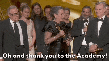 Oscars 2024 GIF. Oppenheimer wins Best Picture. Emma Thomas starts to turn towards her cast and crew before remembering something important to say. She gestures out with her arms and widens her eyes while she says, "Oh and thank you to the Academy!"