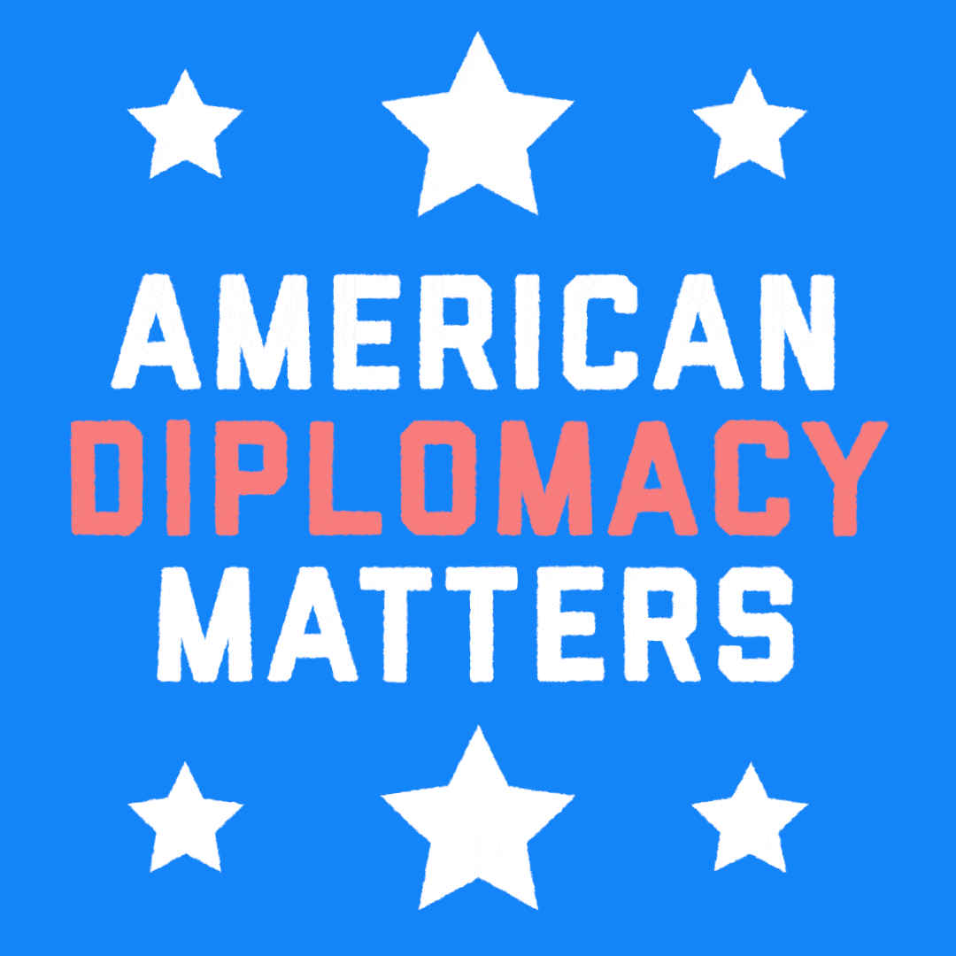 Text gif. White and coral type text between white stars on a sky blue background. Text, "American diplomacy matters."