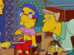 The Simpsons gif. A red-faced Millhouse sits in an exam room, holding his breath and sucking in his tummy. He can't help but breathe, allowing his belly to relax and pop out. A doctor measures him with calipers and slaps a "fat" sticker on his belly.