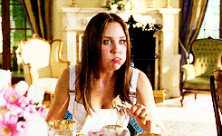 girl stuffing her face with food GIF
