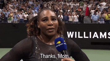 Sports gif. Serena Williams is being interviewed after losing the match to Ajla Tomljanovic at the 2022 US Open. She looks overcome with emotion, chest heaving forward as she says, "Thanks, Mom."