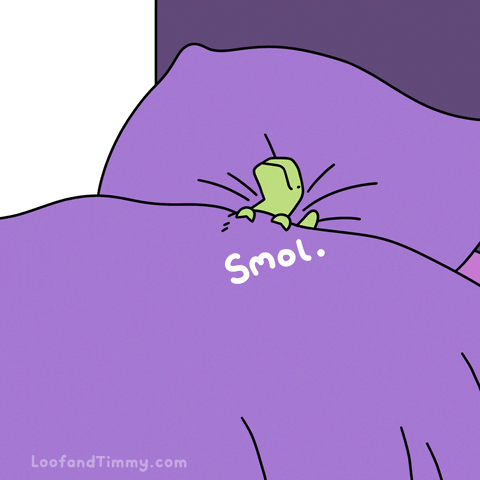 Kawaii gif. Timmy the dinosaur of Loof and Timmy lays in a bed with purple linens and clutches the blanket on top of him. Text, "Smol."