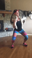 Woman Uses Helpful Husky for Weird Workout