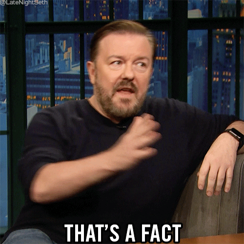 Late Night gif. Ricky Gervais looking intently at Seth and declaring, "That's a fact," while putting his hand down on the table for emphasis.