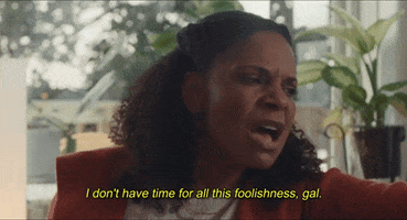 Movie gif. Audra McDonald as Miss Hale in Origin. She's sitting on the couch and looks upset as she strongly says, "I don't have time for all this foolishness, gal." which appears as text.