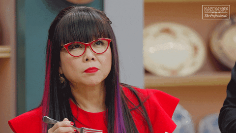 Cherish Finden tastes something, closes her eyes, and makes a disgusted face