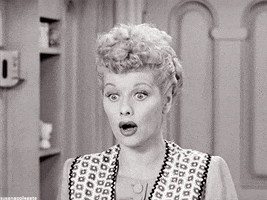 Celebrity gif. In a black and white I Love Lucy episode, Lucille Ball opens her eyes wide in surprised delight, as she says, “ooooh.”
