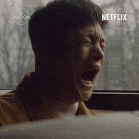 TV gif. Seo In Guk as Han-Joon in the Korean drama, Café Minamdang. He is sobbing openly on a train, his entire face warped with pain, and his mouth hangs open. He is clearly in agony as he puts a hand to the window, trying to stabilize himself.