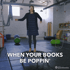 Woman jumping around happy. Words on the bottom read: WHEN YOUR BOOKS BE POPPIN'