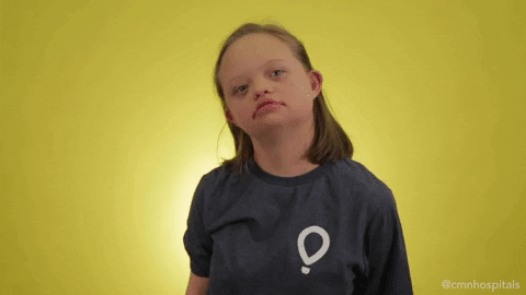 Video gif. A young girl adopts the Thinker pose, finger to her chin, eyes looking upward in searching consideration.