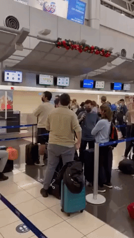 Passengers Gather at Costa Rica Airport Amid Christmas Eve Flight Disruption