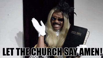 Video gif. Wearing a long blonde wig, white gloves, sunglasses, and a flowery black headpiece, Robert E. Blackmon holds a large bible in one hand as he waves at us and speaks with apparent passion. Text, "Let the church say amen!"