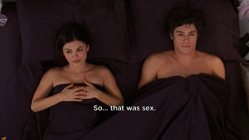 TV gif. Rachel Bilson as Summer on The OC, glances to the side with her hands over her chest, lying in bed under sheets with Adam Brody as Seth, who stares up and says, "so... that was sex," which appears as text.