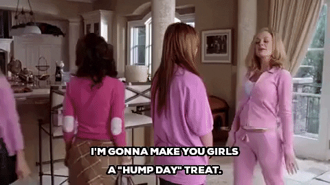 Movie gif. As the girls turn and walk away, Amy Poehler as Mrs. George in "Mean Girls" strikes a pose and then walks toward the kitchen, saying, "I'm gonna make you girls a 'hump day' treat" which appears as text.