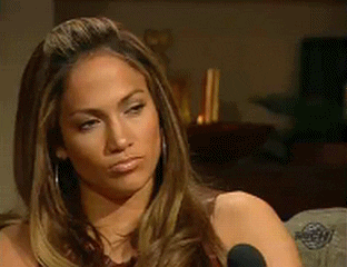 Celebrity gif. Jennifer Lopez purses her lips as if in thought as she stares ahead. 