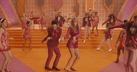 Music video gif. From Taylor Swift's Me, Taylor and Brendon Urie dance The Twist.