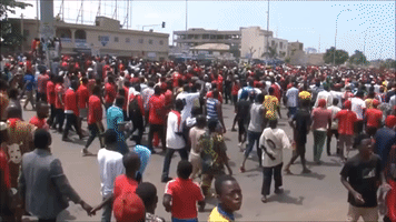 Anti-Government Protesters Flee Tear Gas in Lome