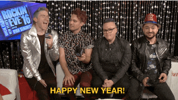 Video gif. The hosts of Dick Clark's New Years Rockin Eve with Ryan Seacrest 2016 say, "Happy New Year!"
