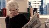 Movie gif. Meryl Streep as Miranda Priestly in The Devil Wears Prada sits at her desk with the newspaper in front of her. She looks up and whips her glasses off her face. She purses her lips as she thinks. 