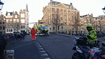 Emergency Helicopter Takes Off on Amsterdam Canal Bridge