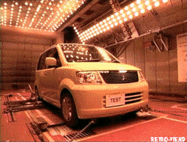 Video gif. Light yellow minivan with a license plate that reads "TEST" appears in a series of shots showing its progression from being in auto repair to being washed and sent out on the road. In some scenes, it traverses through harsh weather and tough surfaces.
