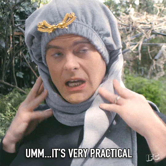 GIF of Bill Hader from the episode Sandy Passage, with gray sweatpants on his head like a hat and scarf with the words, "Umm...It's very practical" at the bottom.