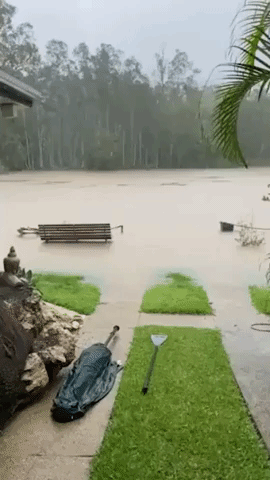 Home Threatened by Overflowing Creek During Queensland Storm