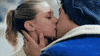 TV gif. Lili Reinhart as Betty and Cole Sprouse as Jughead in Riverdale. They're sharing an intimate kiss and Jughead's hands are gently holding Betty's cheek and neck.