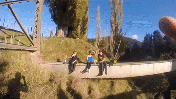 Fearless Mates Brave 200-Foot Drop Off Bridge in New Zealand