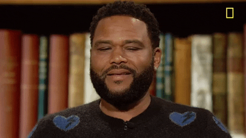 TV gif. Actor Anthony Anderson on Brain Games skeptically scrunches up his face.