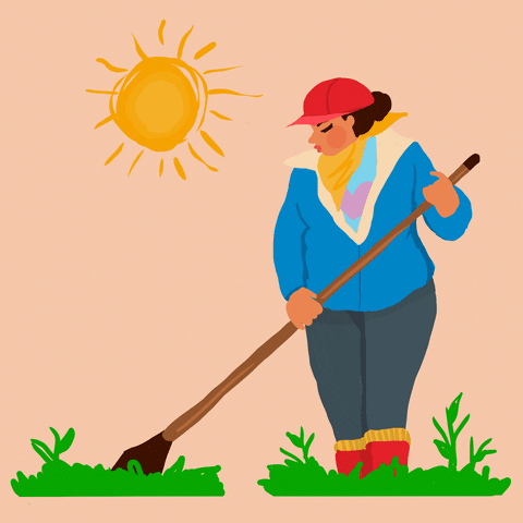 Digital art gif. Woman dressed in thick layers with a blue jacket, long pants, a yellow bandana scarf, and a red cap works outside underneath the bright sun and tends to the grass with a farming tool.