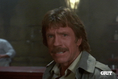 TV gif. Chuck Norris as Walker in Walker Texas Ranger stands in a bar as he yells angrily, running and jump kicking toward us. 