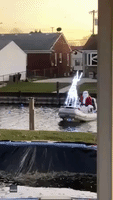 Santa Swaps Sleigh for Speedboat as He Cruises Down Canal in Michigan