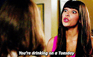 TV gif. Hannah Simone as Cece in New Girl is wide eyed and serious as she attempts to convince Jess and says, "You're drinking on a Tuesday."