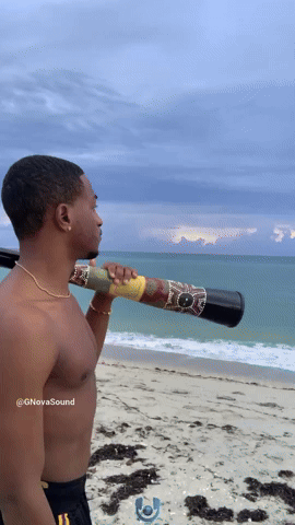 Playing the Didgeridoo By The Seaside, Ocean Waves