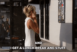 Reality TV gif. Speaking to someone on a cell phone, Heidi Montag on The Hills paces nervously on the street and says, “And I get a lunch break and stuff.”