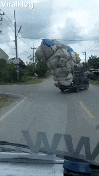 Overloaded Pickup Truck Loses Cargo